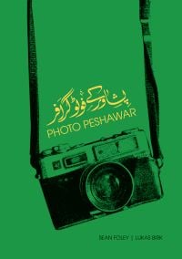 Book cover of Photo Peshawar, with a camera. Published by Mapin Publishing.