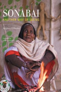 Book cover of Sonabai, with the artist sitting on the floor. Published by Mapin Publishing.