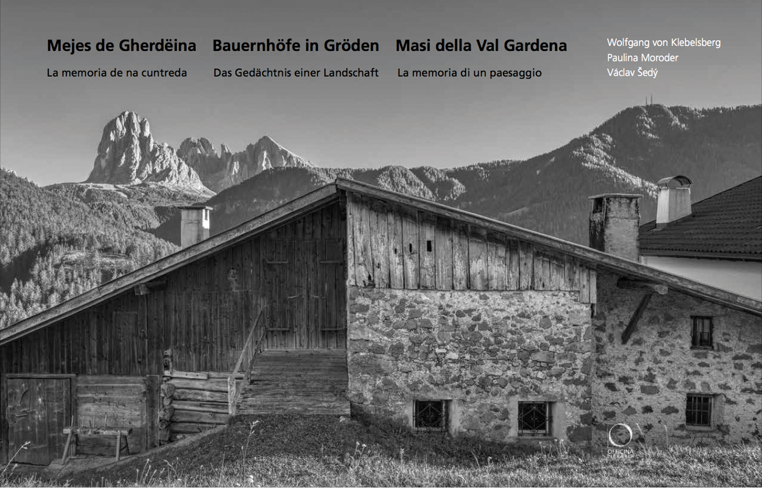 Tritone photo of Farm building in Alpine landscape Mejes de Gherdeina Bauernhoefe in Groeden Masi della Val Gardena in black font above.