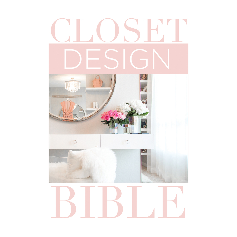 Brighter closet interior with circle mirror, chandelier light, pink roses in vase, on white cover with Closet Design Bible in pale pink and white