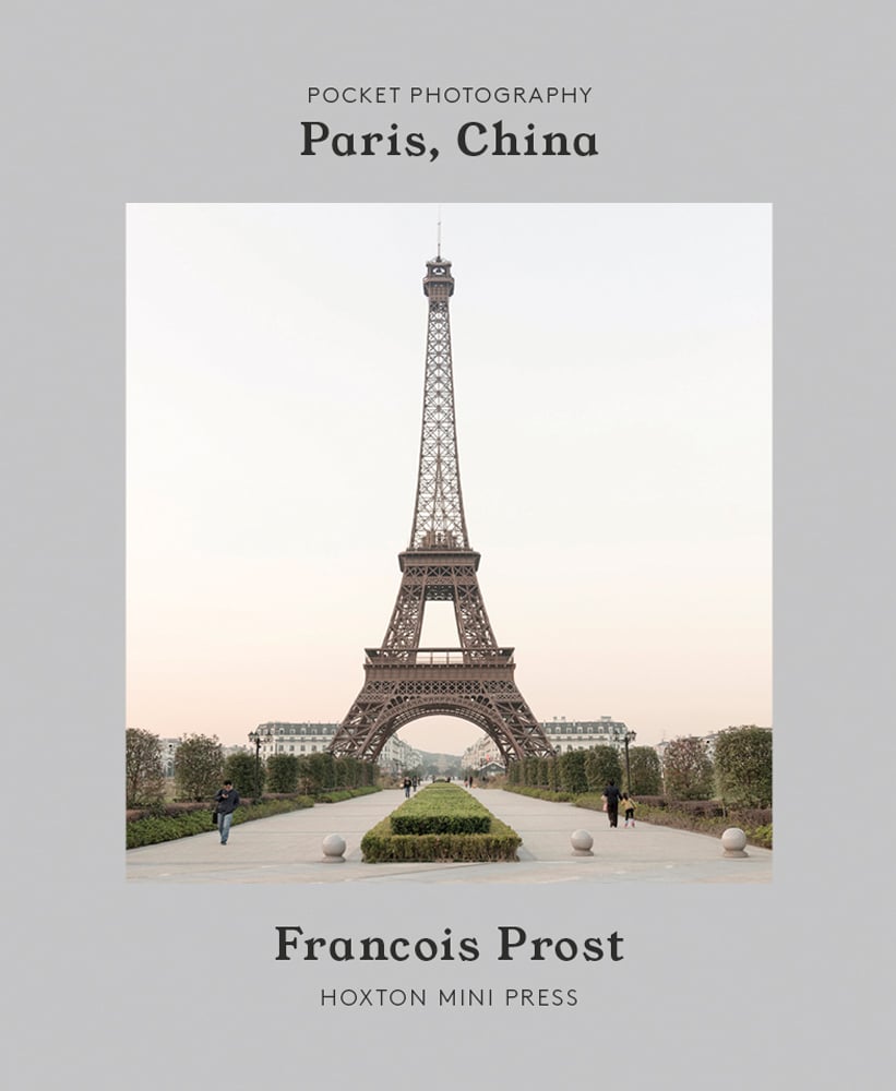 Imitation Eiffel Tower with box hedges lined through center pathway, on grey cover of 'Paris, China', by Hoxton Mini Press.