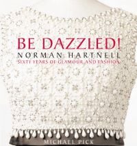 Book cover of Be Dazzled! Norman Hartnell Sixty Years of Glamour & Flash, with a white beaded bodice on a mannequin. Published by Pointed Leaf Press.