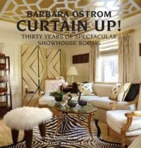 Book cover of Curtain Up! Thirty Years of Spectacular Showhouse Rooms, with a luxury living room interior with a zebra patterned rug, mohair stool, and glass table. Published by Pointed Leaf Press.