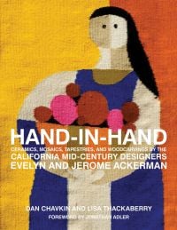 Book cover of Hand-in-Hand: Ceramics, Mosaics, Tapestries, and Wood Carvings by the California Mid-Century Designers Evelyn and Jerome Ackerman, with a tapestry of a figure carrying a bowl of fruit. Published by Pointed Leaf Press.
