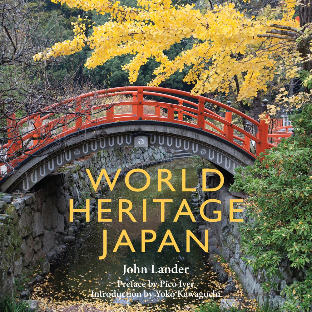 Shinto sanctuary in Kyoto, Shimogamo Shrine, red Japanese bridge with yellow leafed tree, on cover of 'World Heritage Japan', by River Books.