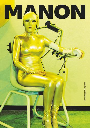 Manon seated in shiny gold bodysuit, electrical wires to right, Manon in black font above