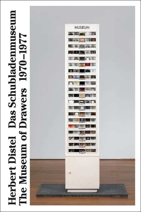 Book cover of The Museum of Drawers 1970-1977: Five Hundred Works of Modern Art, featuring a tall cabinet of drawers. Published by Scheidegger & Spiess.