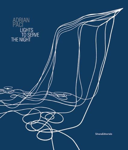 Book cover of Adrian Paci: Lights to Serve the Night, with white wires cascading down, curled on floor. Published by Silvana.