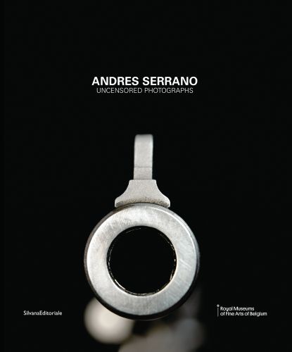 Close up of pistol barrel, black cover, ANDRES SERRANO UNCENSORED PHOTOGRAPHS in white font above.