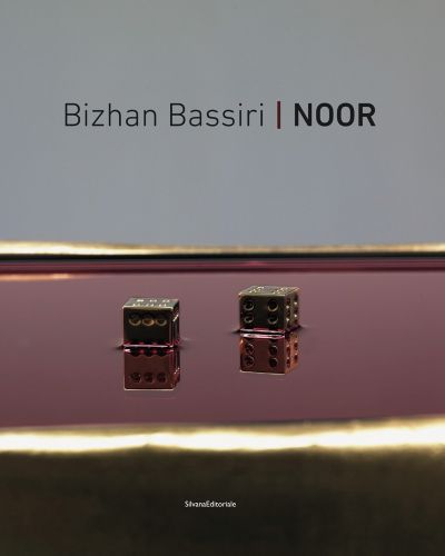 2 gold dice sitting in dark pink liquid, grey cover, Bizhan Bassiri Noor in black font above