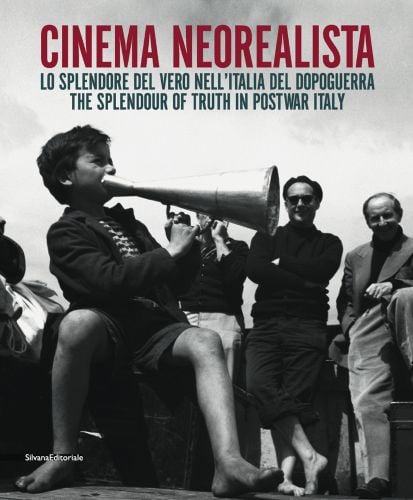 Young boy sitting on box, holding metal megaphone, 3 male figures behind smiling, CINEMA NEOREALISTA in red font above