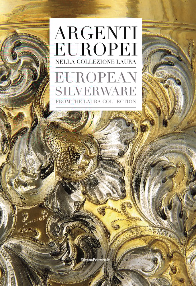 Close up, silver and gold decorative, floral metal surface, EUROPEAN SILVERWARE in grey font on white box to top