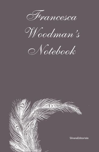 Francesca Woodman's Notebook in white font on taupe cover, white feather below