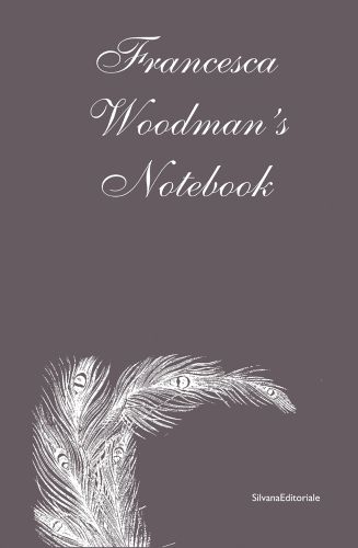 Francesca Woodman's Notebook in white font on taupe cover, white feather below