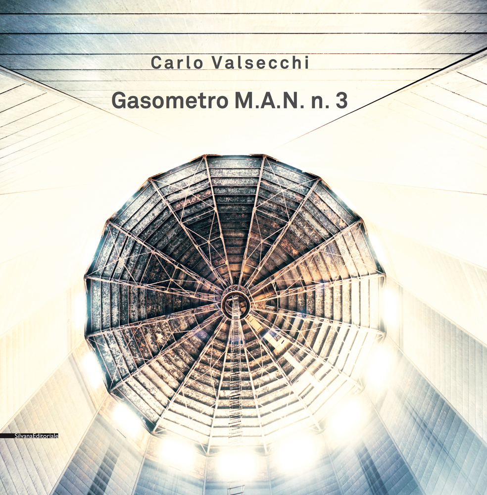 Aerial view of geometrical top of Gasometro, Carlo Valsecchi Gasometro M.A.N. n. 3 in dark grey font above