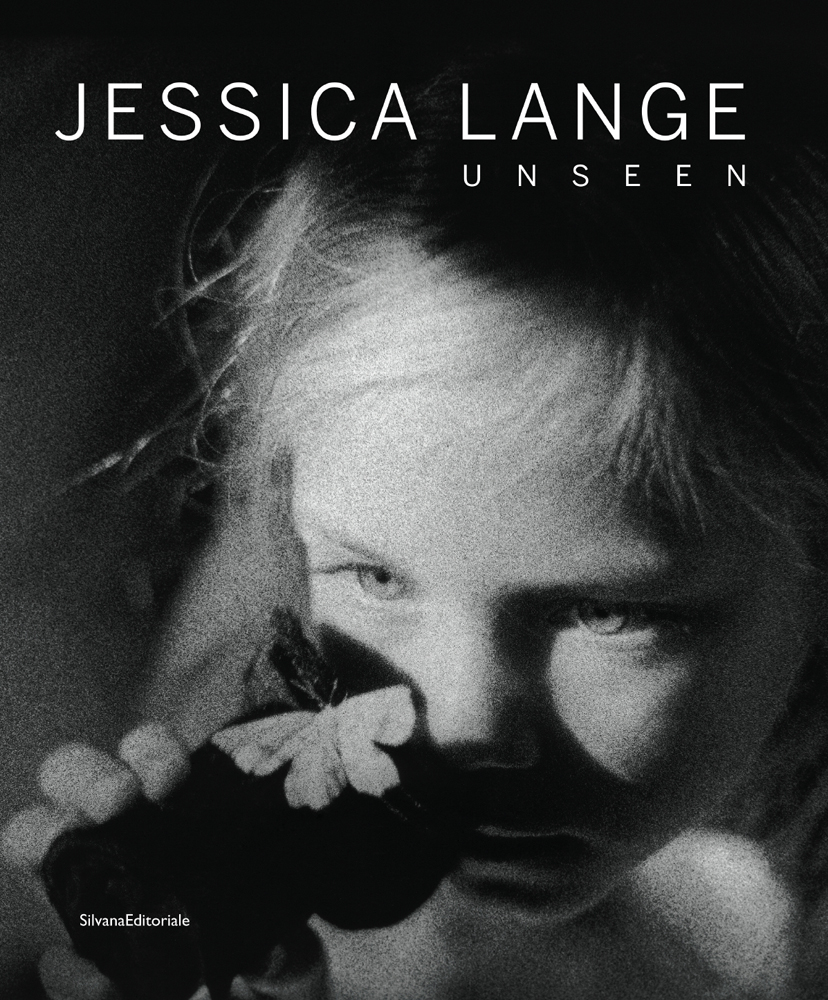Close up face of young child holding black camera lens, pale butterfly on top, JESSICA LANGE UNSEEN in white font above.