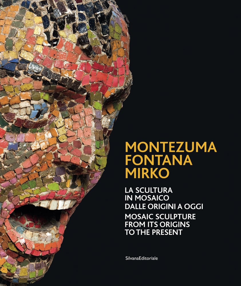 Sculpture of screaming face made of colourful mosaic squares, black cover, MONTEZUMA FONTANA MIRKO in yellow font to lower right