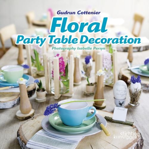 Book cover of Floral Party Table Decorations, with a table laid with mats made with slices of tree trunk, and blue hyacinths. Published by Stichting.