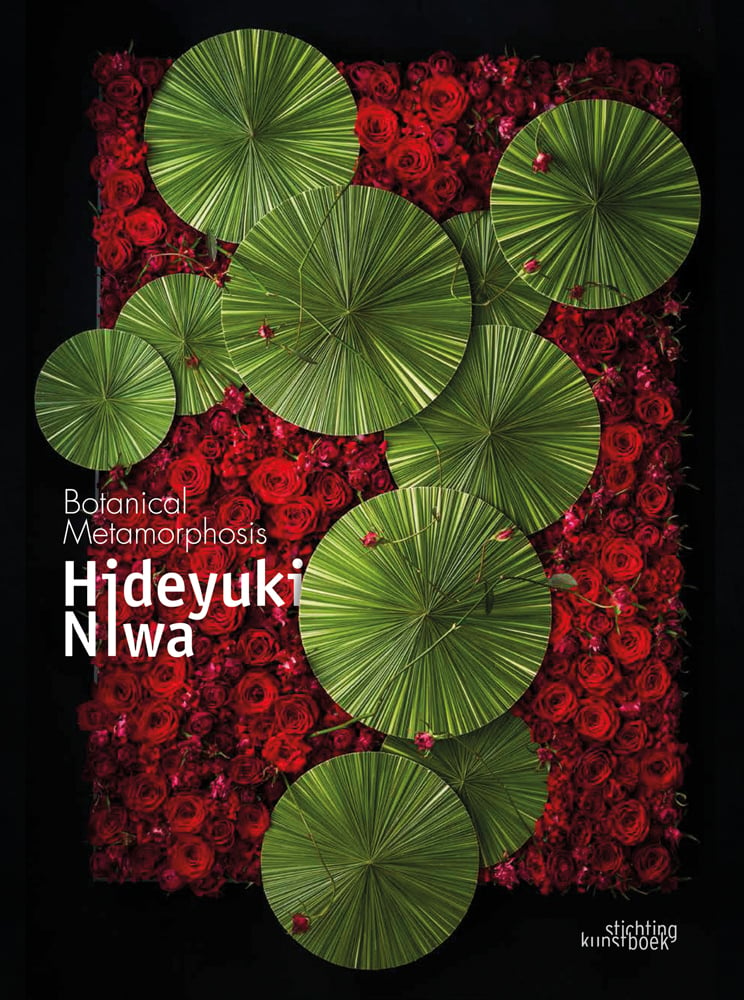 Aerial view of green lily pads surrounded by red roses, on black cover, Botanical Metamorphosis Hideyuki Niwa in white font