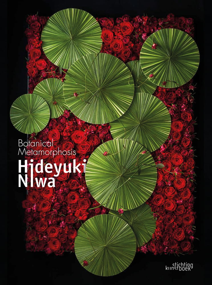 Black book cover of Hideyuki Niwa, Botanical Metamorphosis, with an aerial view of green lily pads surrounded by red roses. Published by Stichting.