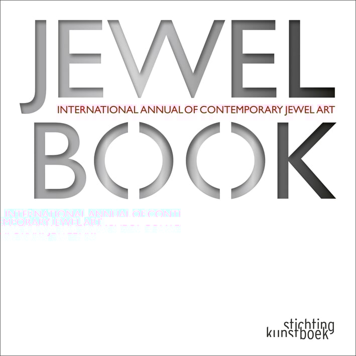 White book cover of Jewelbook, International Annual of Contemporary Jewel Art, with grey, stencilled font. Published by Stichting.