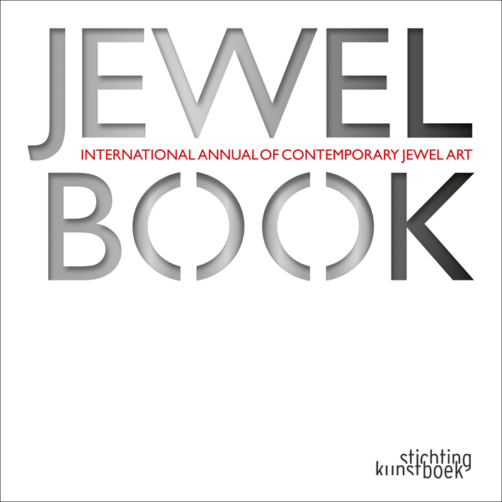 White book cover of Jewelbook, International Annual of Contemporary Jewel Art, with gray, stencilled font. Published by Stichting.