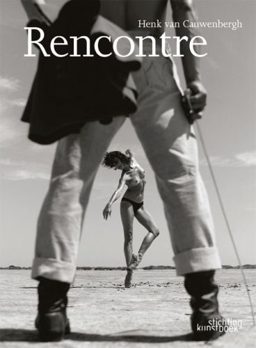 Book cover of Rencontre, with rear of matador holding sword, and view of topless ballerina in mid jump, through matador's legs. Published by Stichting.