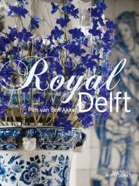 Book cover of Royal Delft, with blue and white ceramic vase containing blue flowers. Published by Stichting.