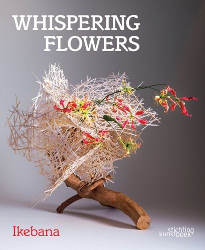 Book cover of Whispering Flowers, Ikebana, with a section of tree branch, a white, stick structure on top, with wavy edged lilies. Published by Stichting.