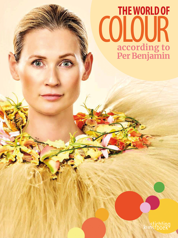 Model wearing ring of pink and yellow lilies around neck, with long thin feathers spraying out, The World of Colour According to Per Benjamin on cream right corner