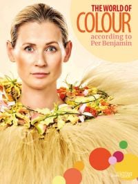 Book cover of The World of Colour According to Per Benjamin, with a model wearing a ring of pink and yellow lilies around neck, with long thin feathers spraying out. Published by Stichting.