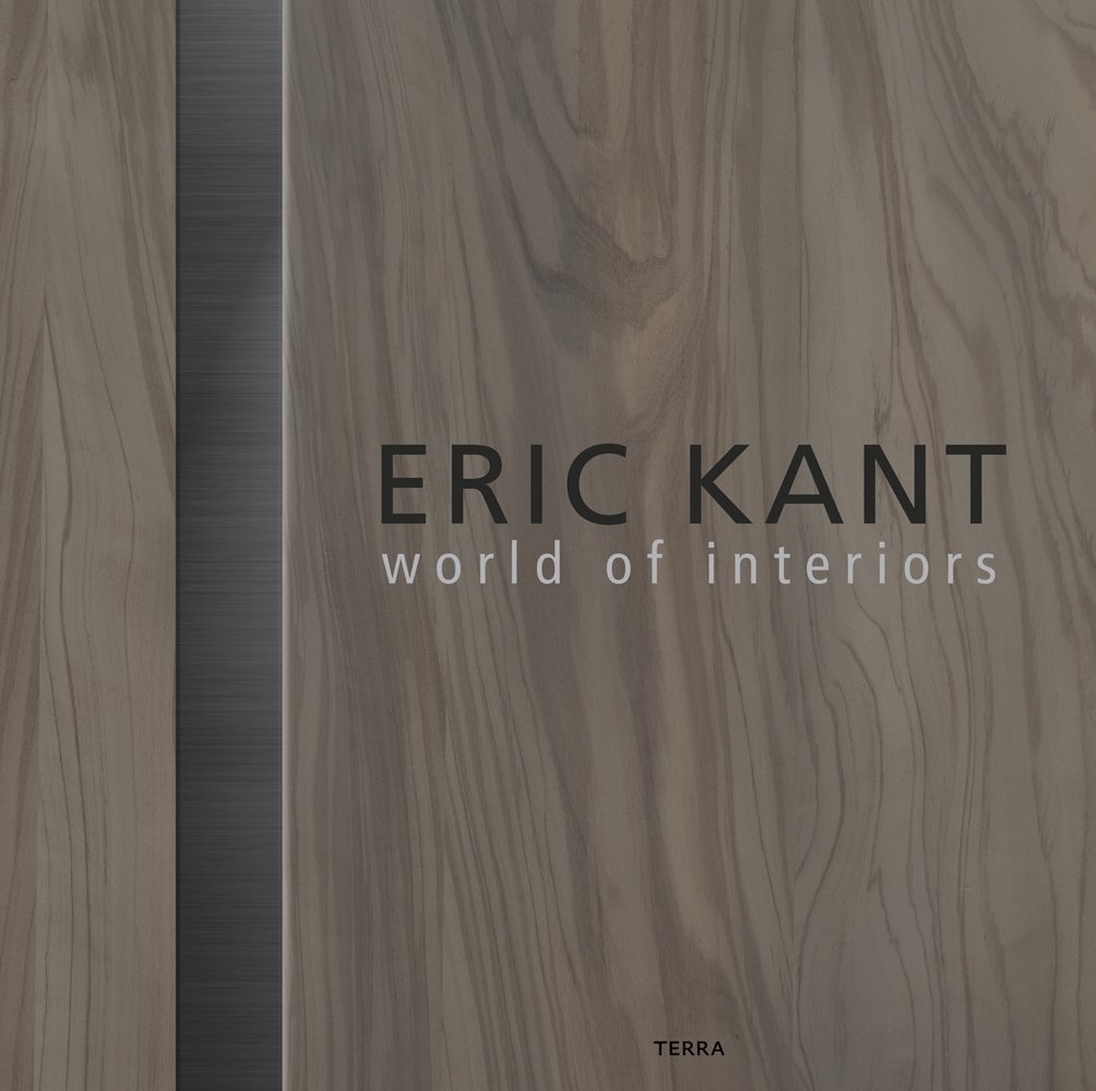 Colour photograph of a piece of veneered wood with Eric Kant world of interiors in brown and white