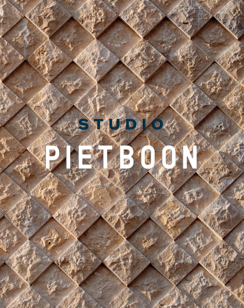 Textured diamond brick wall, on cover of 'Piet Boon: Studio', by Lannoo Publishers.