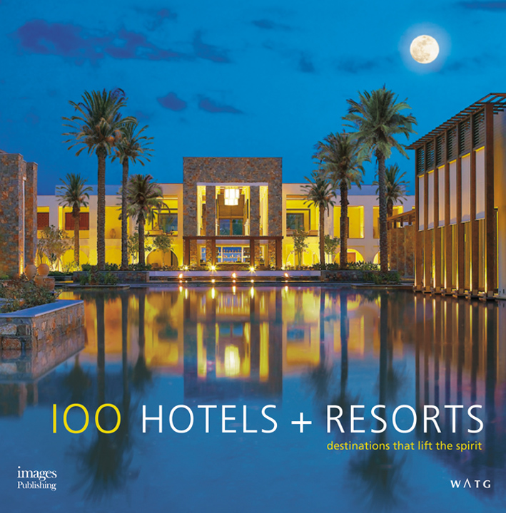 Book cover of 100 Hotels + Resorts: Destinations That Lift the Spirit, with a luxury hotel with swimming pool, under the moonlit sky. Published by Images Publishing.