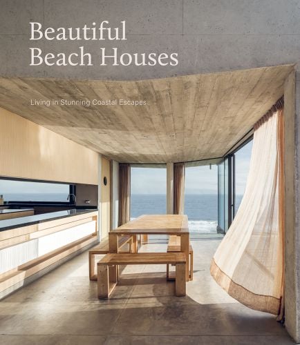 Bright interior of beach house, sea view through windows, curtain billowing to right, Beautiful Beach Houses in white font to upper left.