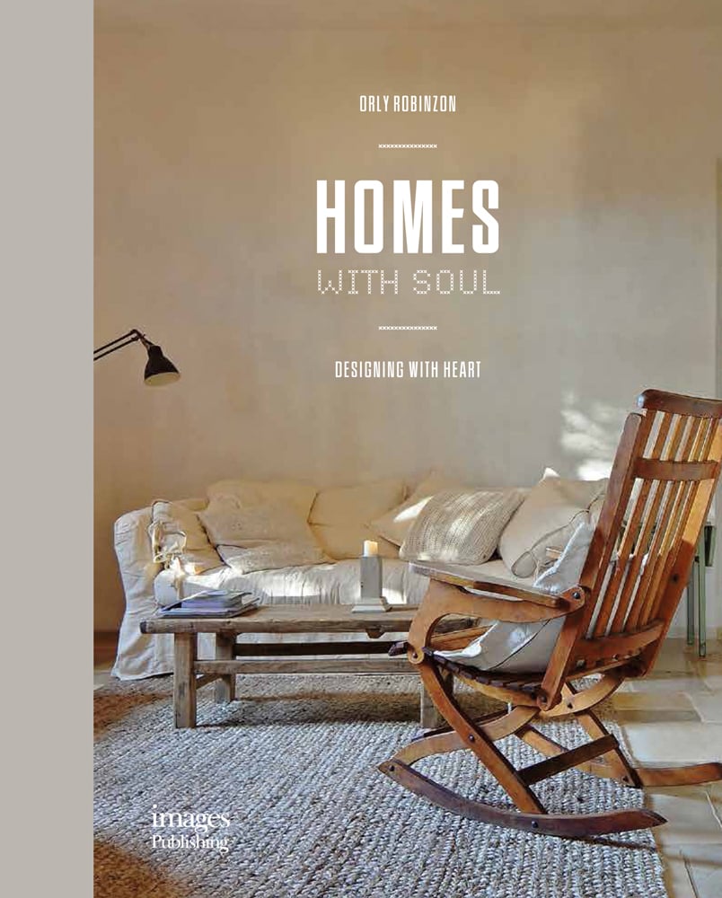 Book cover of Homes With Soul : Designing with Heart, with a wooden rocking chair on woven rug, cream walls and soft sofa. Published by Images Publishing.
