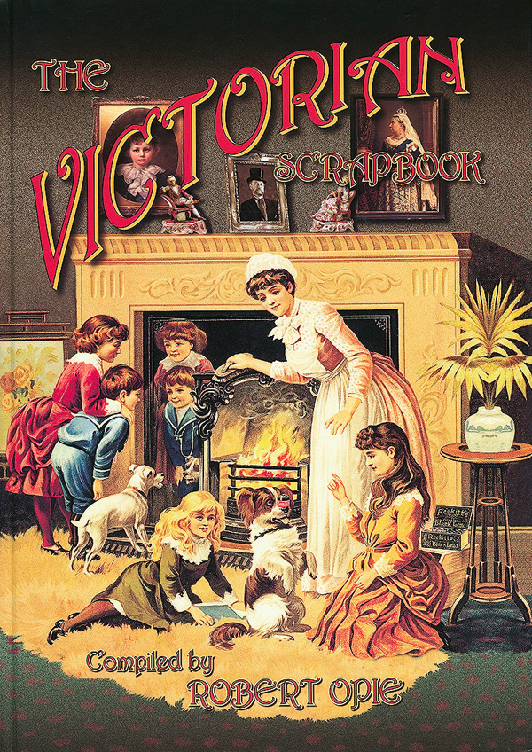 Book cover of The Victorian Scrapbook, featuring a family sitting by a lit fireplace. Published by The Museum of Brands.