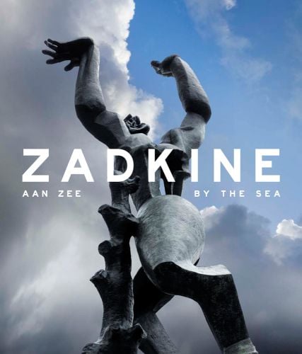 Large bronze memorial sculpture The Destroyed City, cloudy blue sky above, ZADKINE By the Sea in white font to centre