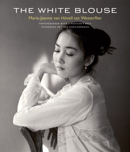 Book cover of The White Blouse, Marie-Jeanne van Hövell tot Westerflier - Photographer with a Painter's Soul, featuring a portrait of Asian female wearing white blouse. Published by Waanders Publishers.