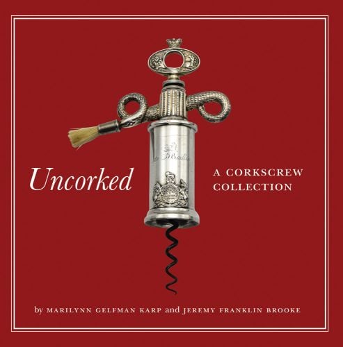 Book cover of Uncorked: A Corkscrew Collection, featuring a silver antique serpent variant corkscrew. Published by Abbeville Press.