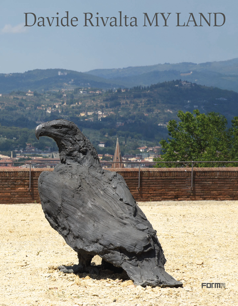 Large black sculpture of eagle on sandy soil, on cover of 'Davide Rivalta MY LAND', by Forma Edizioni.