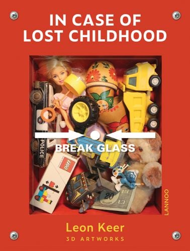 Red emergency fire alarm box filled with childhood toys, LEGO, bear, police car, break glass to front, IN CASE OF LOST CHILDHOOD in white font above.