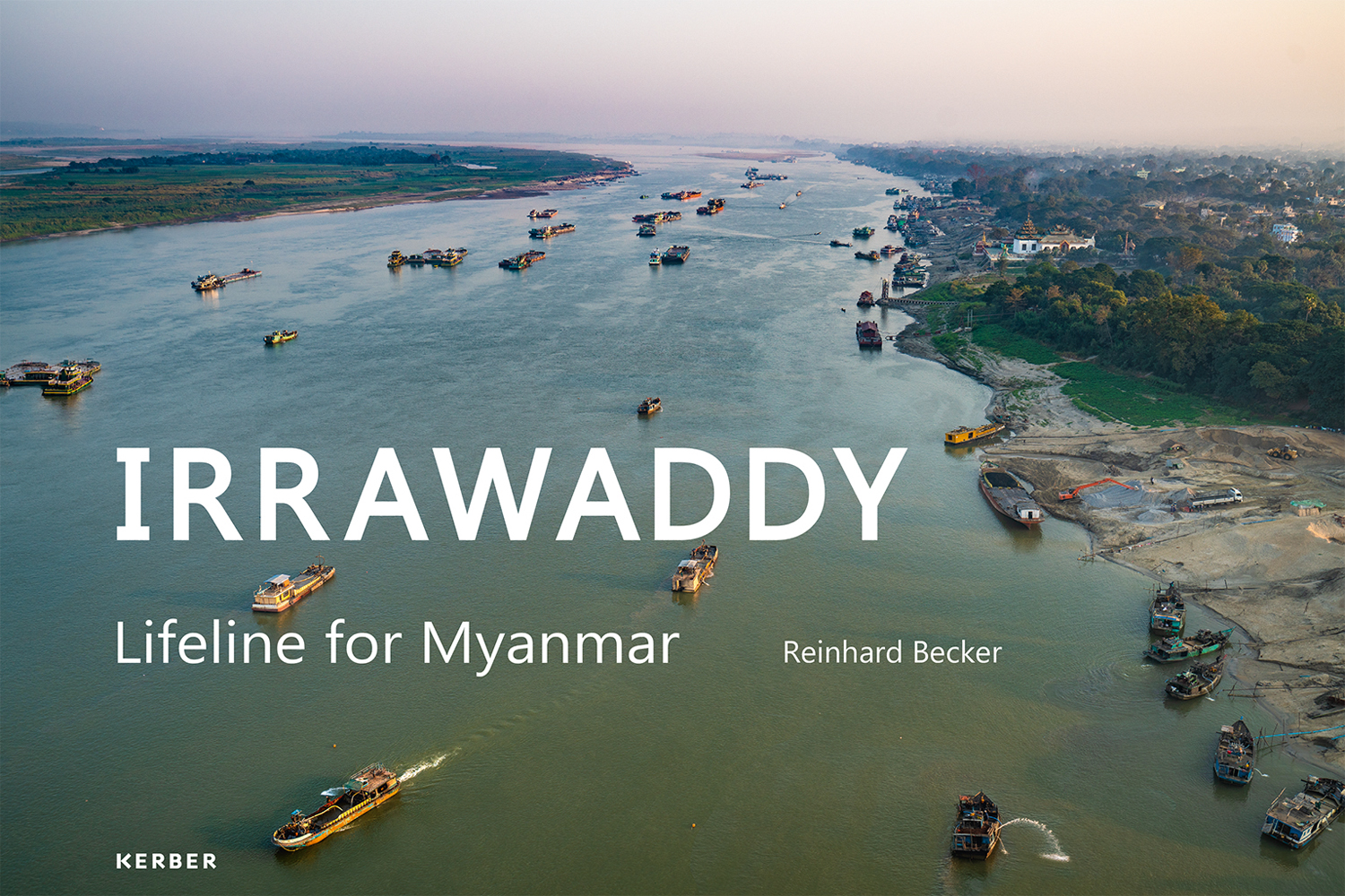 Aerial shot of boats sailing down the Irrawaddy river in Myanmar, IRRAWADDY Lifeline For Myanmar in white font to lower left.