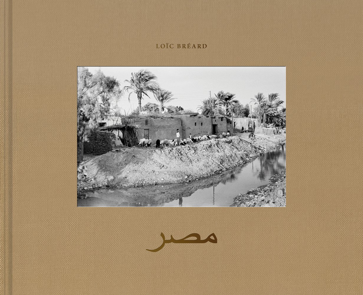 Book cover of Egypt: In the Mirror of Timelessness, with an Egyptian landscape with buildings and a river. Published by Seltmann Publishers.