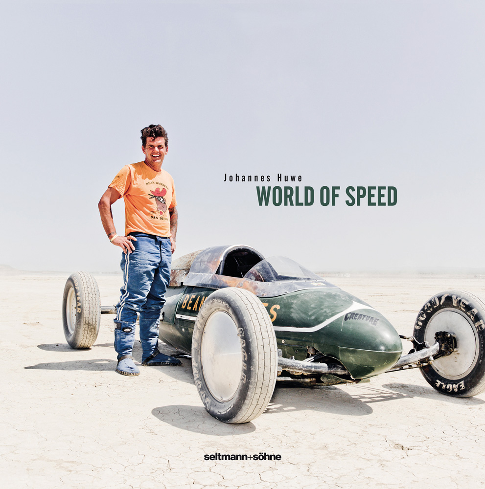 Book cover of World of Speed, with a man standing in the desert next to a home-built racing car. Published by Seltmann Publishers.