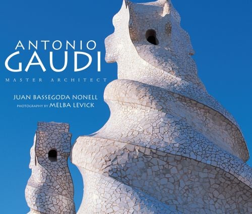 White mosaic style spiral chimney by Gaudi, blue sky behind, ANTONIO GAUDÍ MASTER ARCHITECT in white font above.