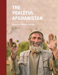 Book cover of The Peaceful Afghanistan: People of Wakhan Corridor, with a man with beard smiling, while holding his hands up. Published by Seltmann Publishers.