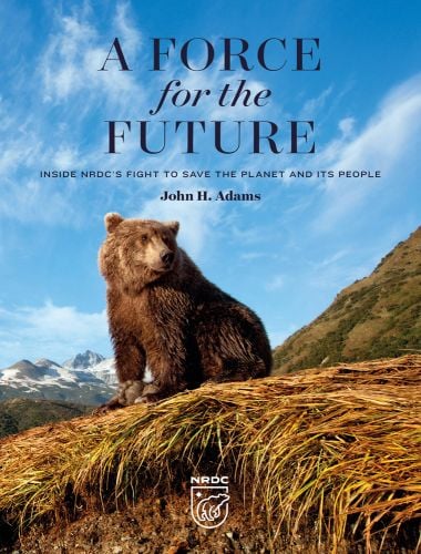 Book cover of A Force for the Future: Inside NRDC's Fight to Save the Planet and Its People, with a large brown bear sitting on top of grassy mound, with mountainous landscape behind. Published by Abbeville Press.