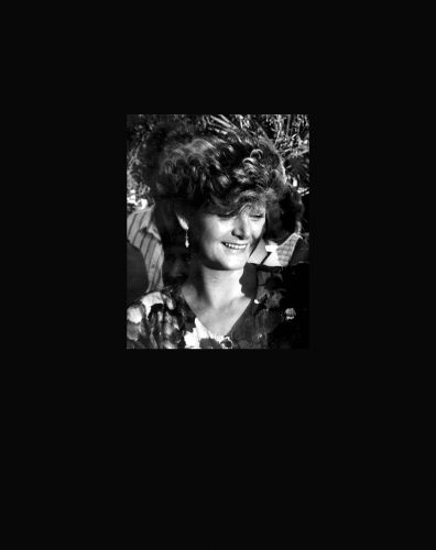 Early portrait shot of Marvin Bohm's mother smiling, on black cover, by Verlag Kettler.