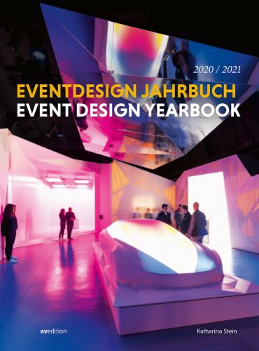 Interior exhibition space, groups of people, 2020/2021 EVENT DESIGN JAHRBUCH EVENT DESIGN YEARBOOK in orange and white font above.